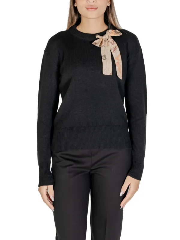Rosa Schleife auf schwarzem Pullover Rosa Schleife auf schwarzem Pullover