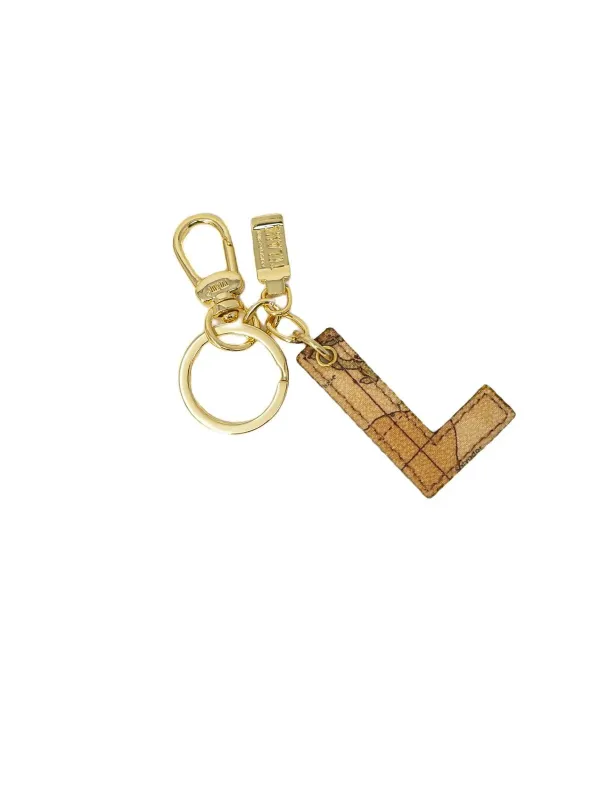 Goldfarbener Schlüsselanhänger mit Stoffmuster Goldfarbener Schlüsselanhänger mit Stoffmuster