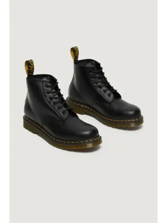 Schwarze Dr. Martens Lederstiefel gelb