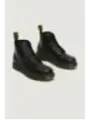 Schwarze Dr. Martens Lederstiefel gelb