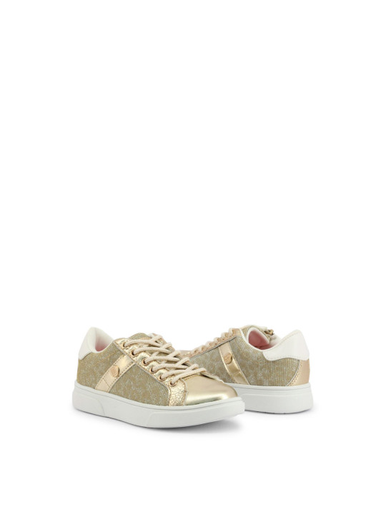 Goldene Kinderschuhe mit weißem Akzent