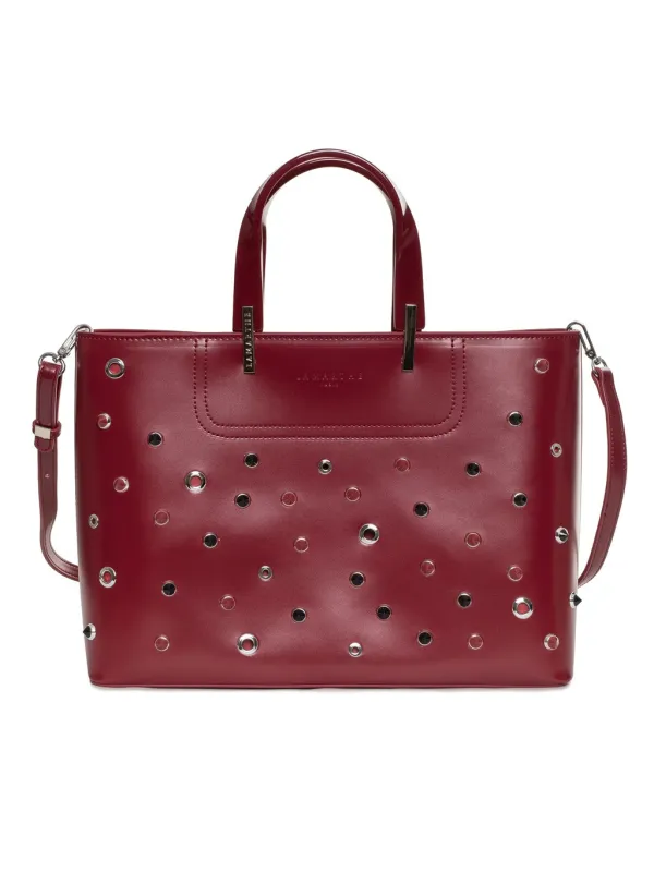 Rotes Lederhandtasche mit reflektierenden Ösen