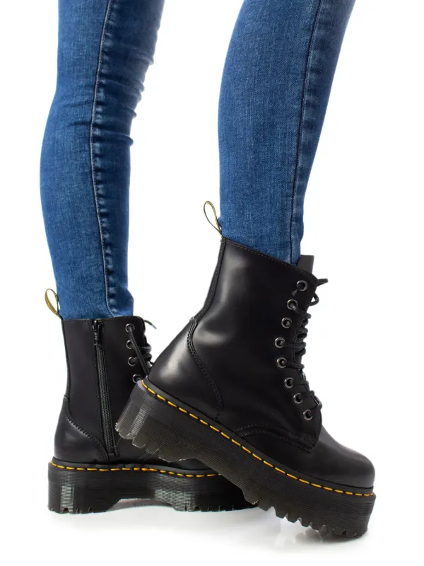 Schwarze Lederstiefel mit gelber Naht